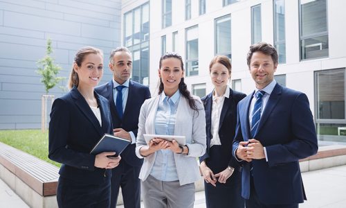 businesspeople-standing-outside-office-building Graduate Diploma of Management (Learning)