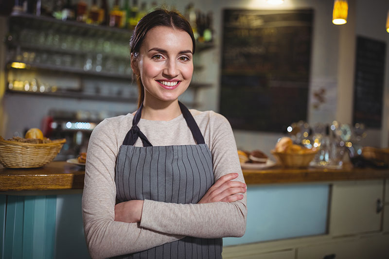 portrait-smiling-waitress-standing-counter portrait-smiling-waitress-standing-counter