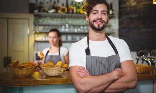 smiling-waiter-standing-with-arms-crossed-cafa-c SITHFAB002 Provide Responsible Service of Alcohol